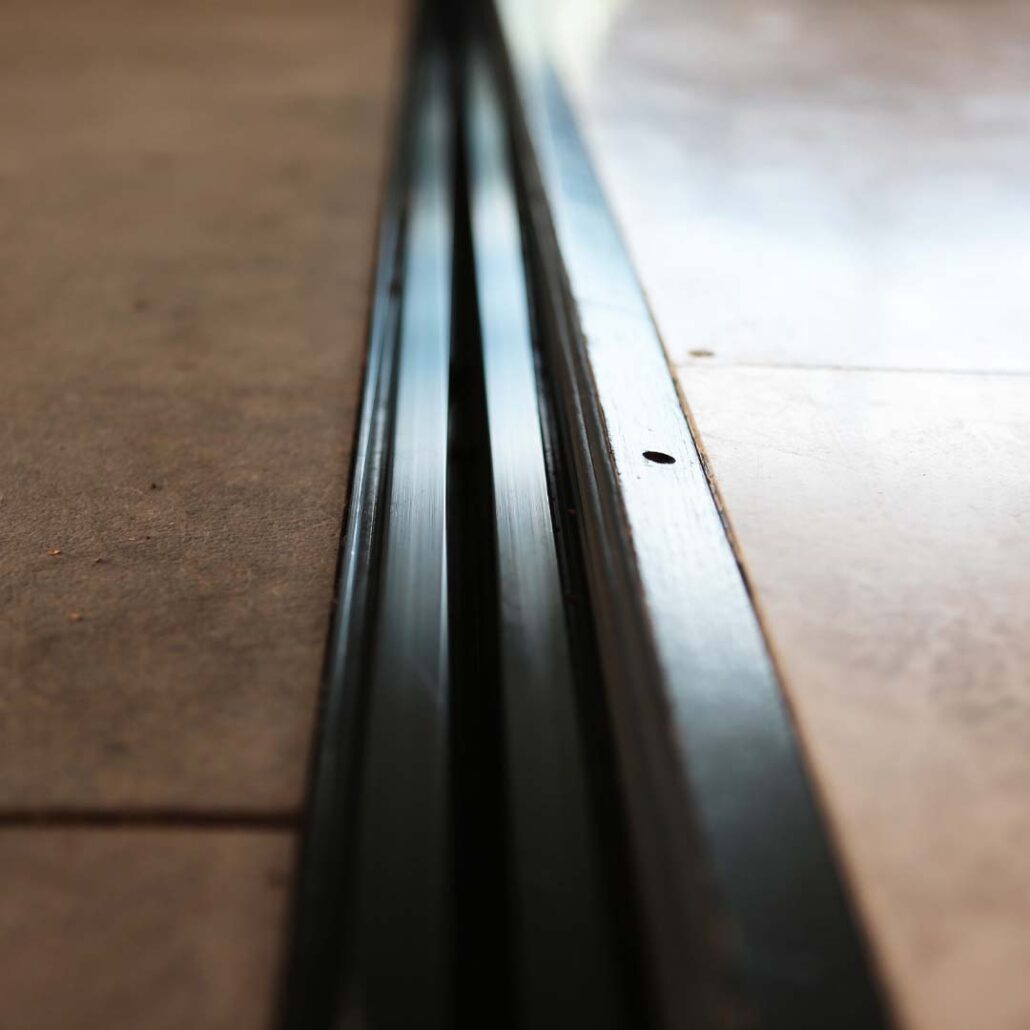 clean and maintained track system for folding sliding door system